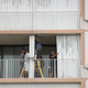 Workers put up Hurricane Shutters on a condo in Boynton Beach, Florida. Image: Getty